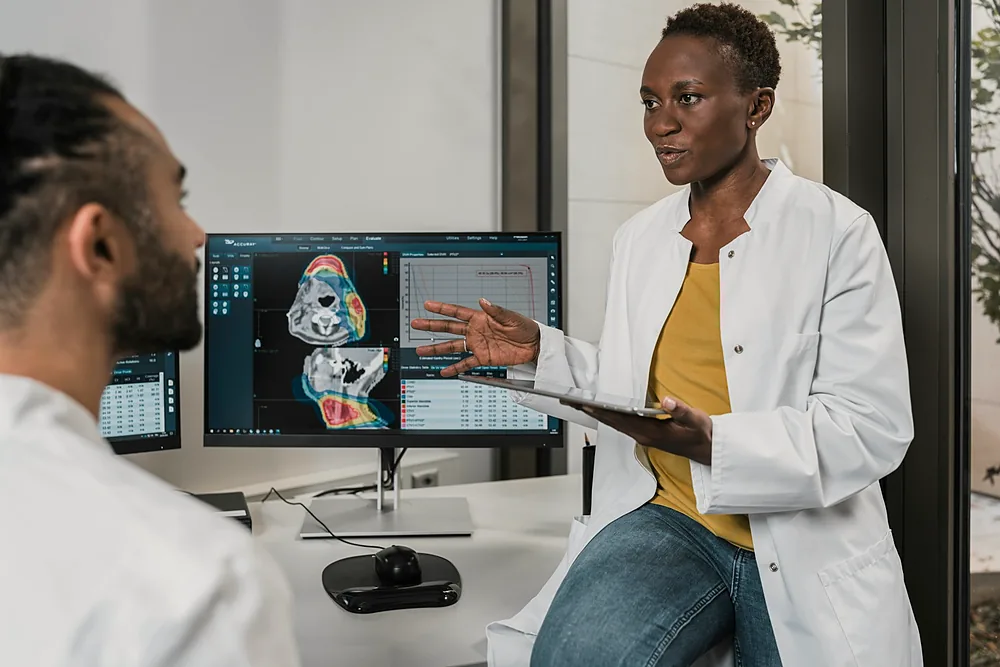 Clinicians reviewing blood biomarker results at Aurae